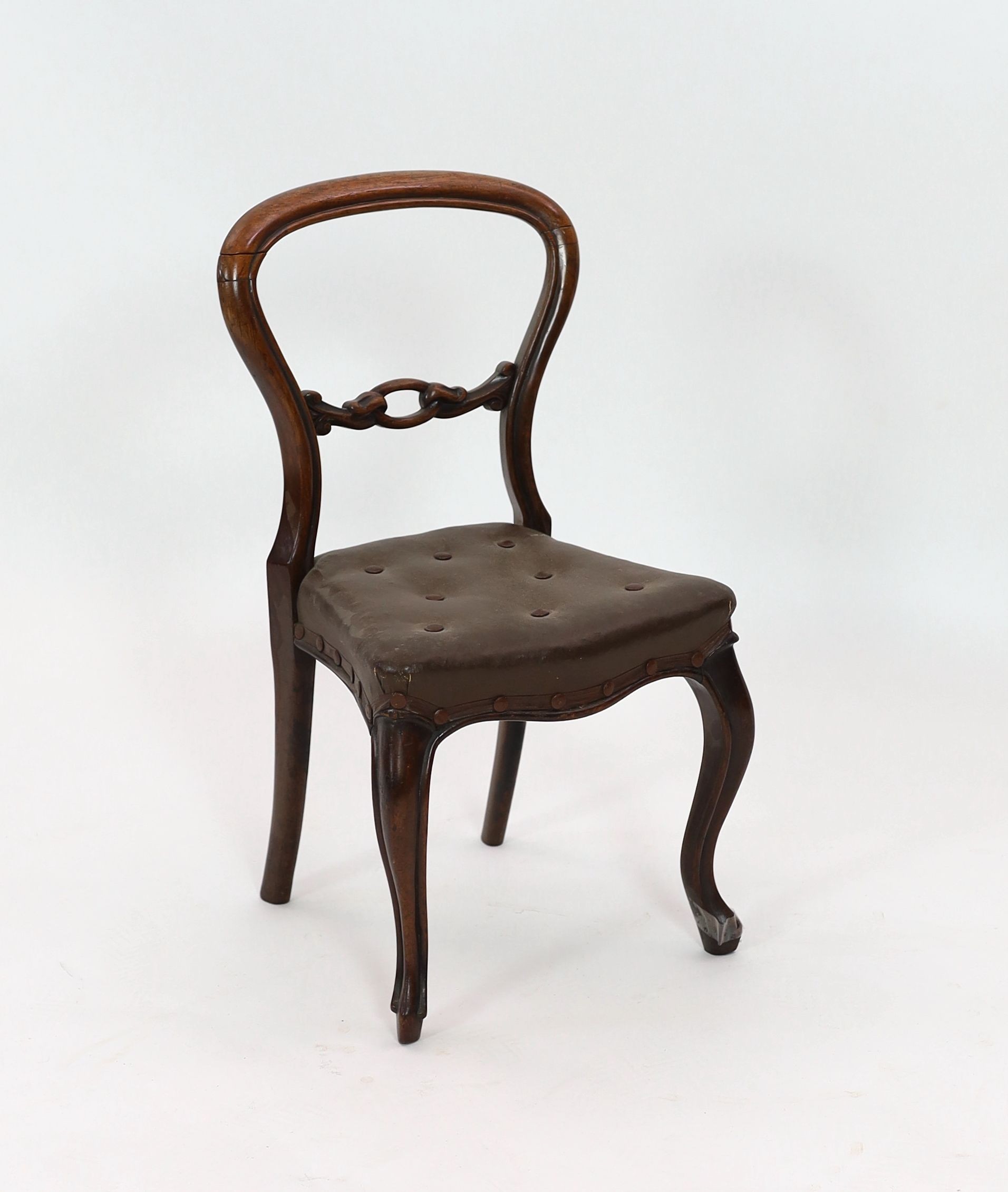 A Victorian faded rosewood spoonback child's chair, height 63cm
